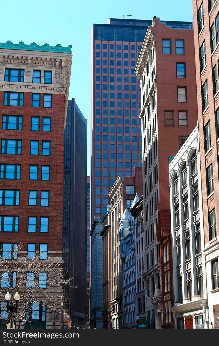 Mixture of old and new buildings line street in downtown boston. Mixture of old and new buildings line street in downtown boston