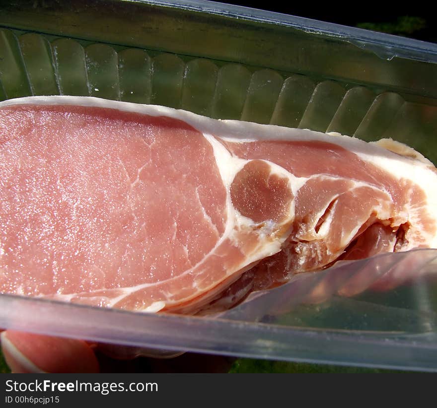 An image of some sliced bacon within its package. An image of some sliced bacon within its package.