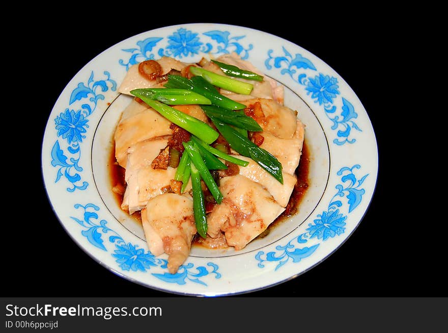 A plate of white cut chicken ready to be served. A plate of white cut chicken ready to be served