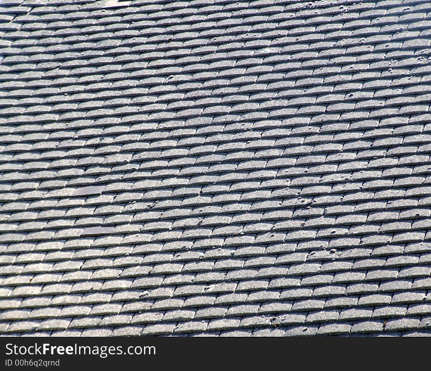 A photo of a roof top tile pattern background. A photo of a roof top tile pattern background.