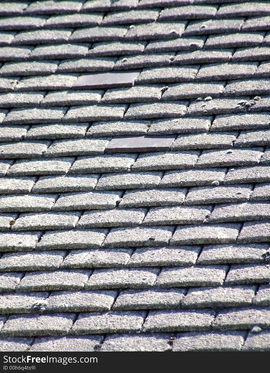 A photo of a roof top tile pattern background. A photo of a roof top tile pattern background.