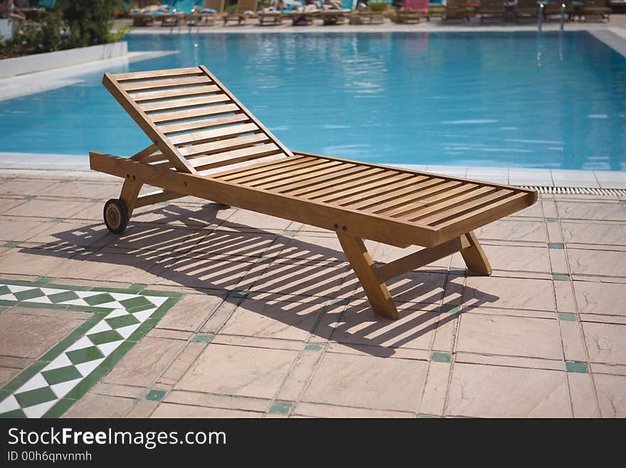 Sun lounger close to the pool. Sun lounger close to the pool