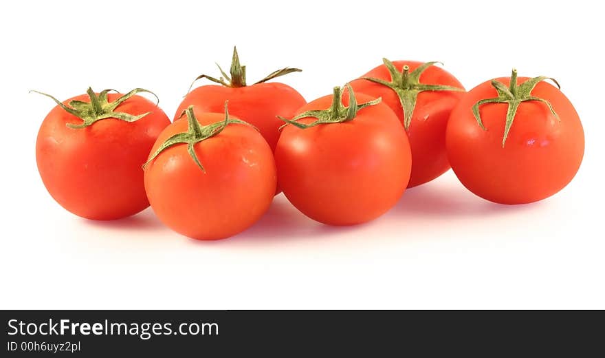 Some tomato lay on a white background. Some tomato lay on a white background.