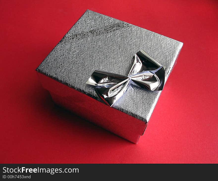 Small box with knot on red background. Small box with knot on red background