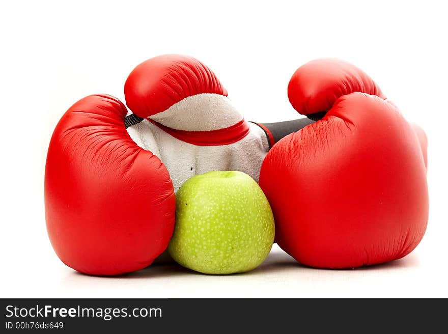 Boxing gloves and an apple. Boxing gloves and an apple