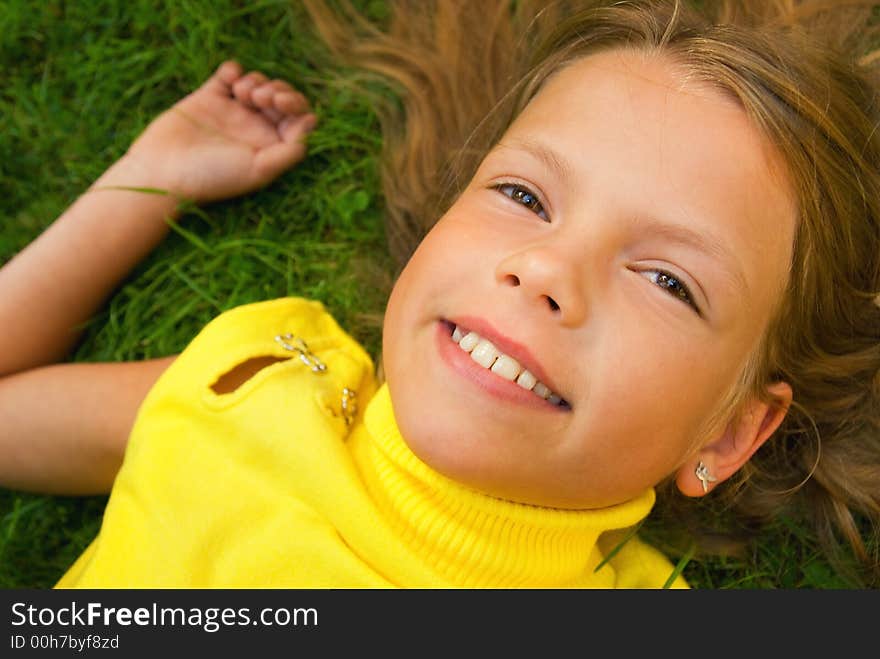 Little girl lying on a grass. Little girl lying on a grass