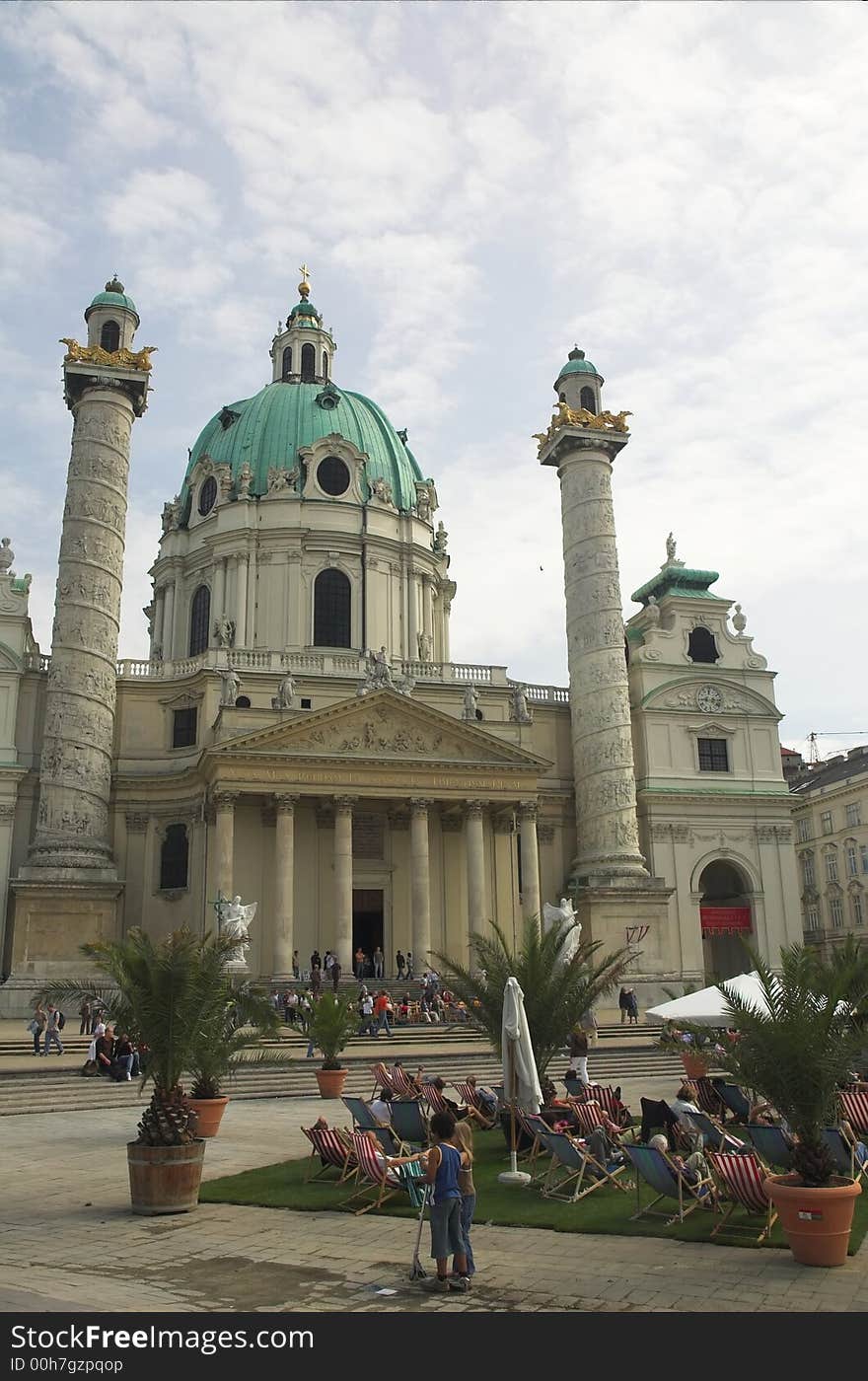 Sunbathers et the St. Charles Cathedral (Karlskirche) in Vienna.