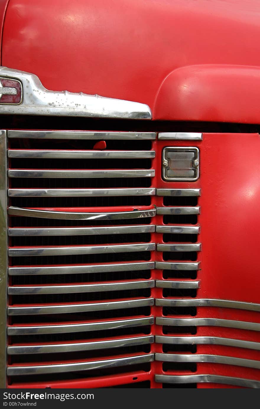 The front grill of an old farm truck. The front grill of an old farm truck