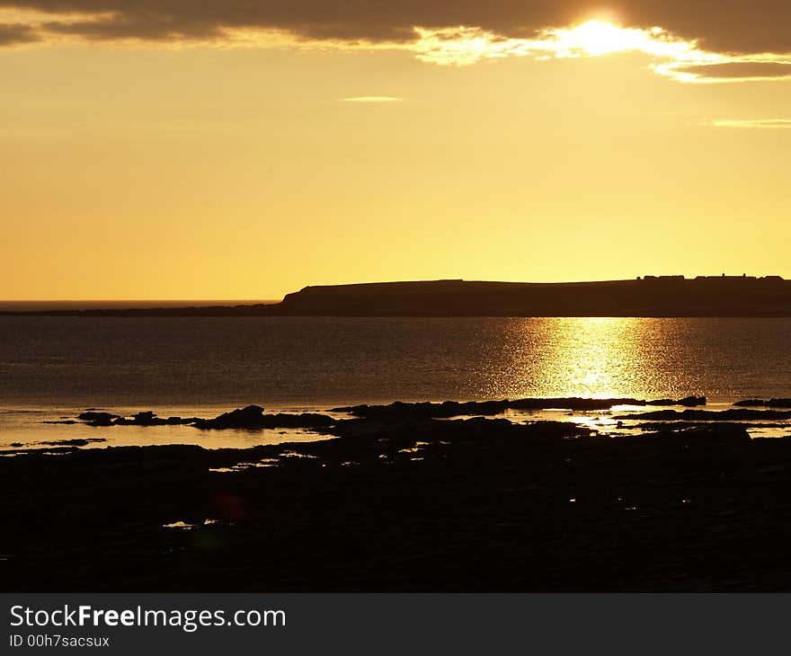 Sunset near Stromess with cliff. Sunset near Stromess with cliff