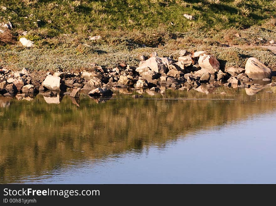 Reflection of rocks in water