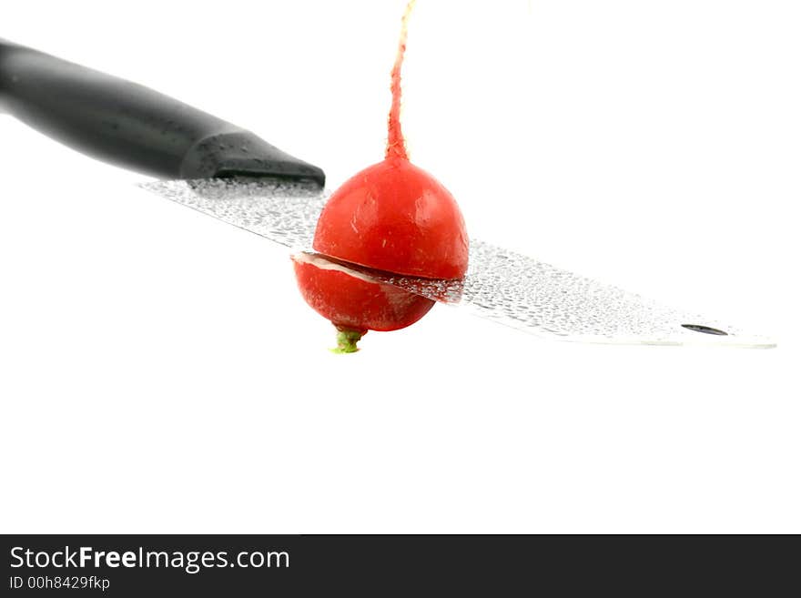 Radish cut with cleaver on a white background