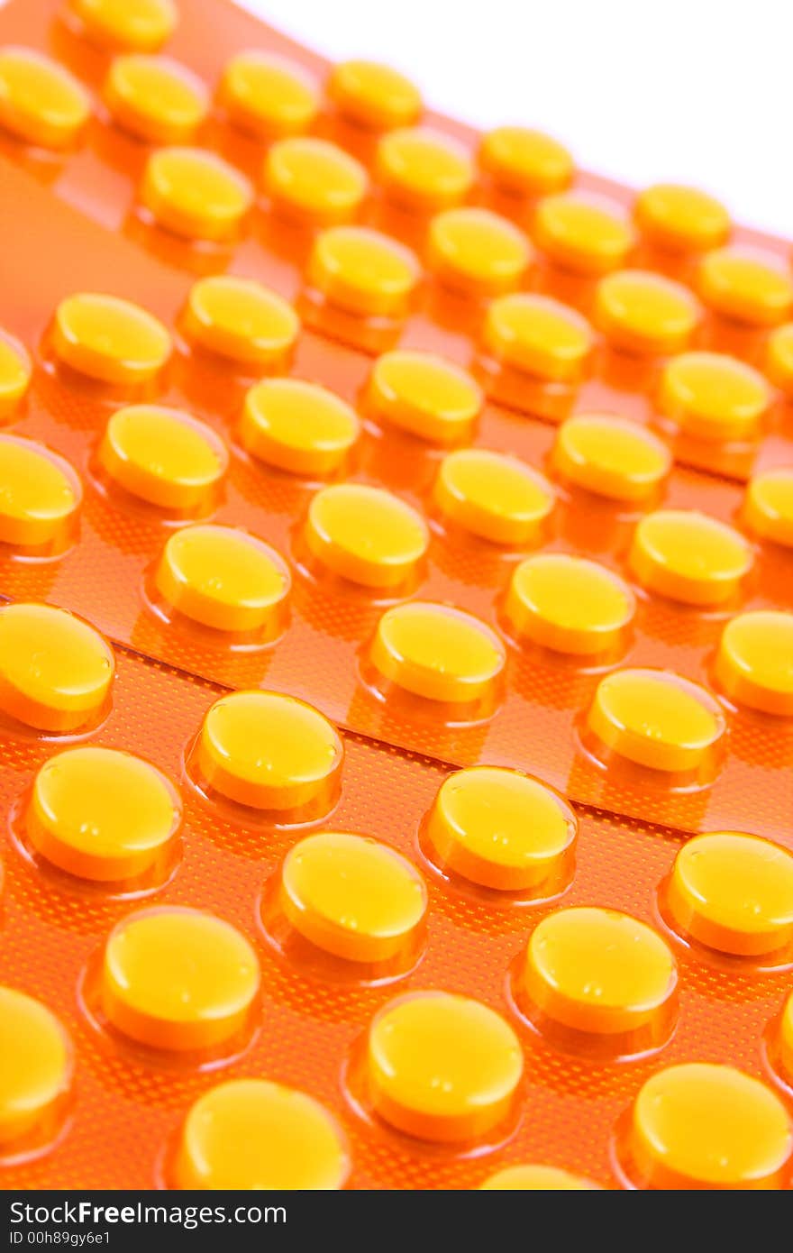 Tablets and vitamin pills in different shapes and colors. Tablets and vitamin pills in different shapes and colors