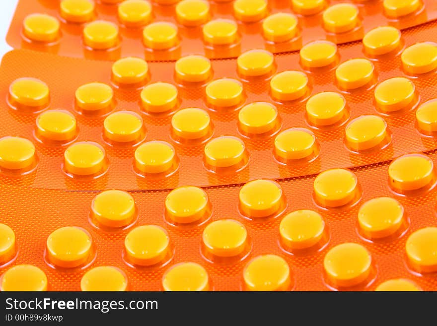 Tablets and vitamin pills in different shapes and colors. Tablets and vitamin pills in different shapes and colors