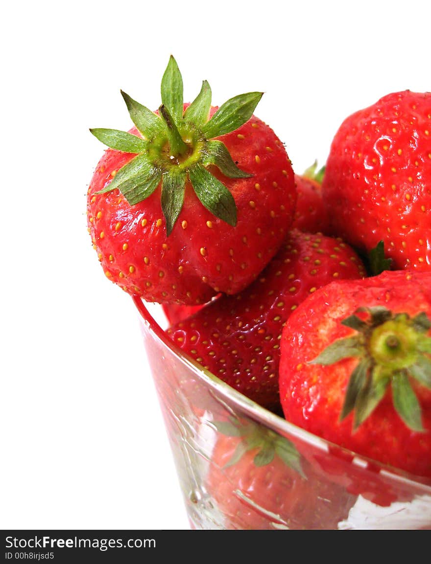 Strawberry in glass over white background