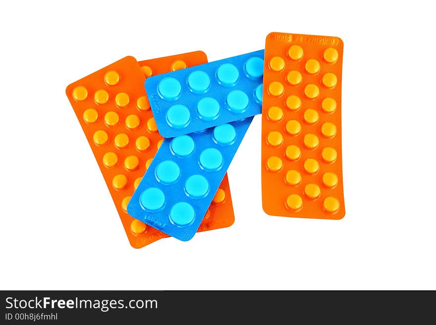 Tablets and vitamin pills in different shapes and colors. Tablets and vitamin pills in different shapes and colors