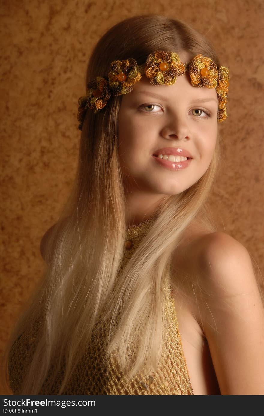 Young girl in wreath in knitted gown