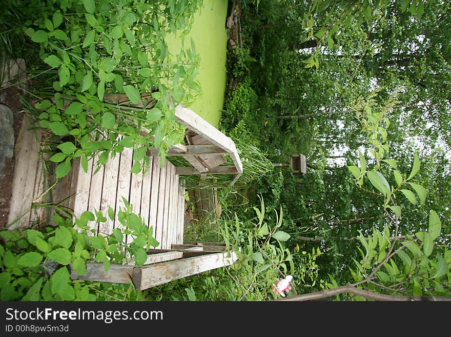 A bridge sits over a pond. A bridge sits over a pond