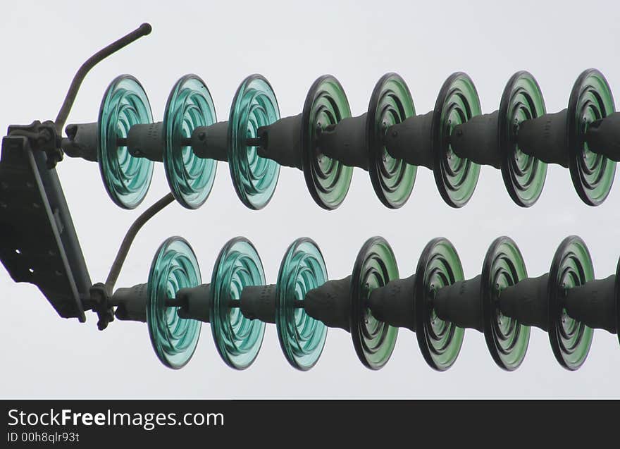 Detail of a pylon, disk parts where the wires start off from the pylon. Detail of a pylon, disk parts where the wires start off from the pylon.