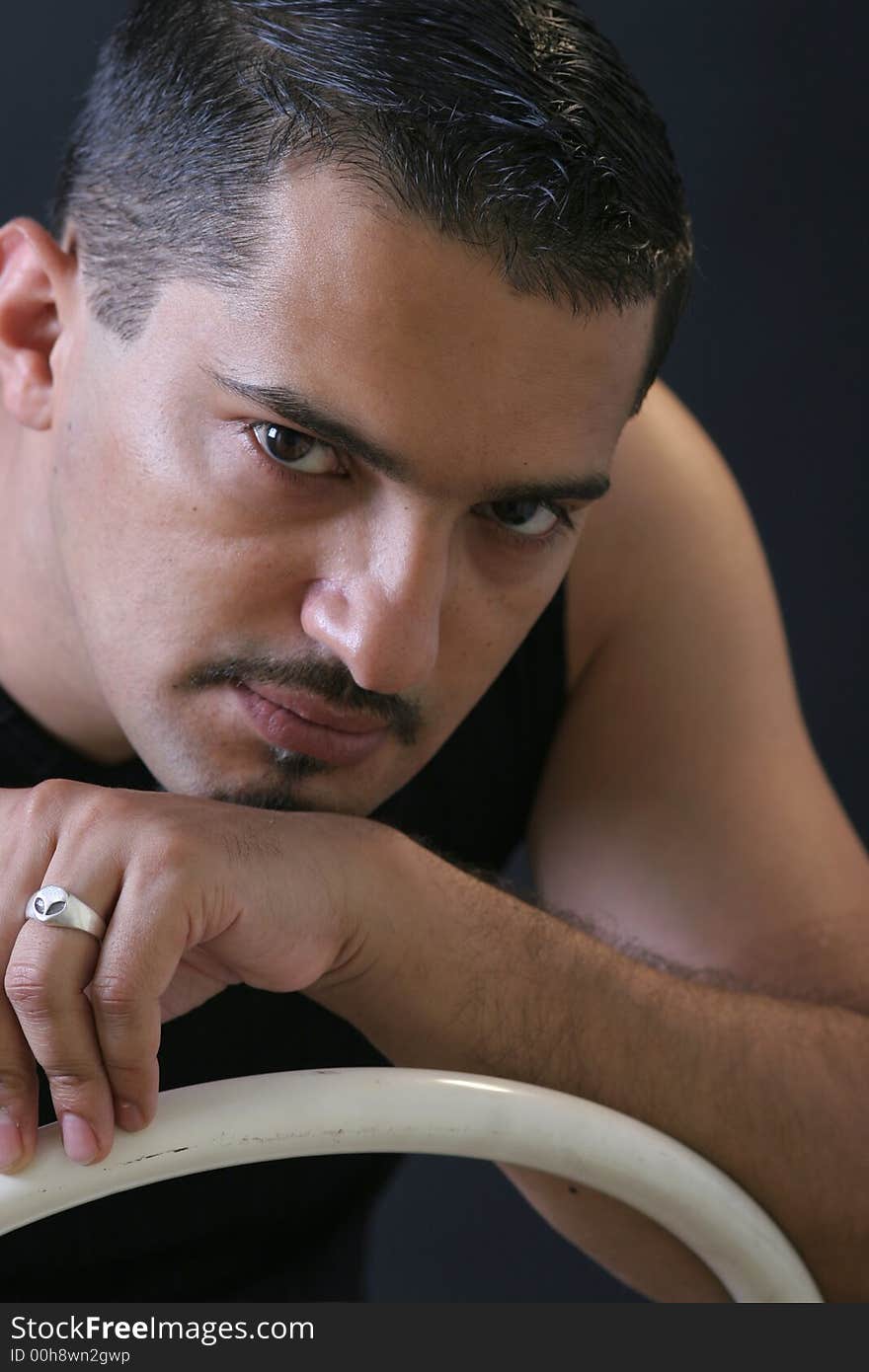 Portrait of a young man on the chair