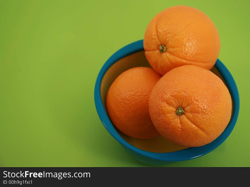 Four Fresh Oranges Full Shot on Green Backgorund