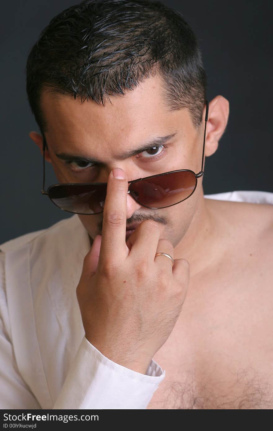 Portrait of a young man with sun glasses. Portrait of a young man with sun glasses