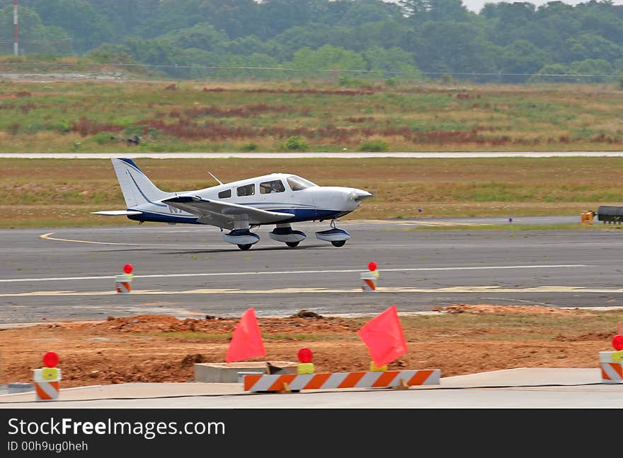 Blue and White Plane Landing