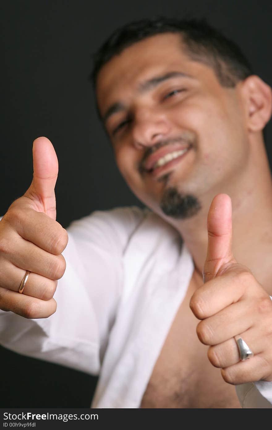 Portrait of a young man with thumb up. Portrait of a young man with thumb up