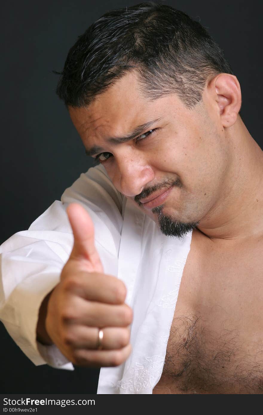 Portrait of a young man with thumb up. Portrait of a young man with thumb up