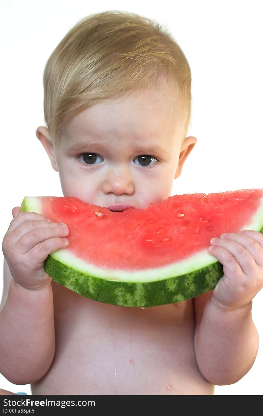 Image of cute toddler eating a big piece of watermelon. Image of cute toddler eating a big piece of watermelon