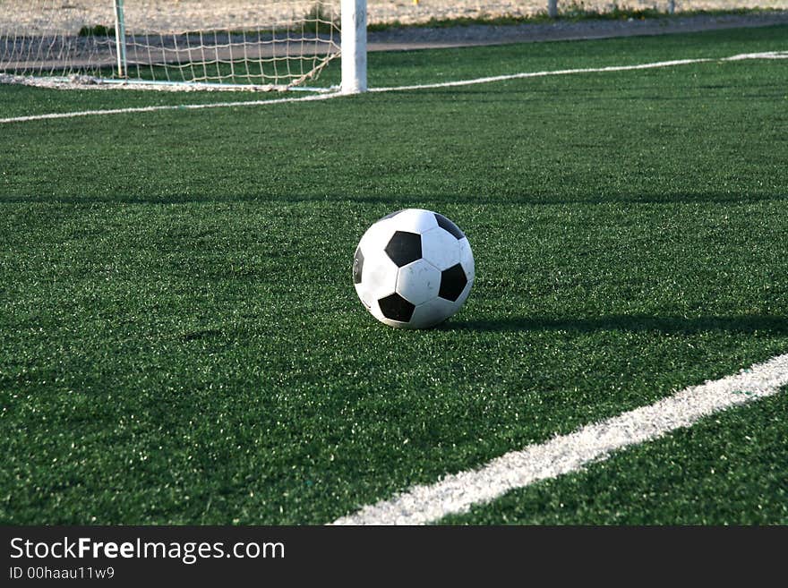 The new football lays on an artificial covering of stadium