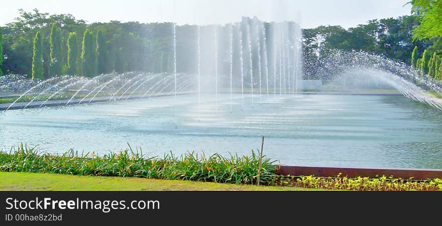 Laser fountain on day time, National Monument, Jakarta. Laser fountain on day time, National Monument, Jakarta