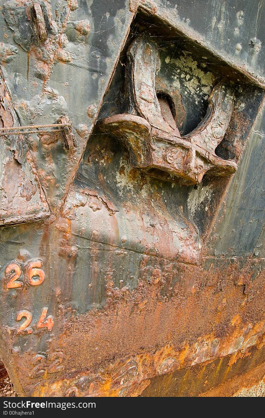 Part of old boat with rusty heavy anchor. Part of old boat with rusty heavy anchor