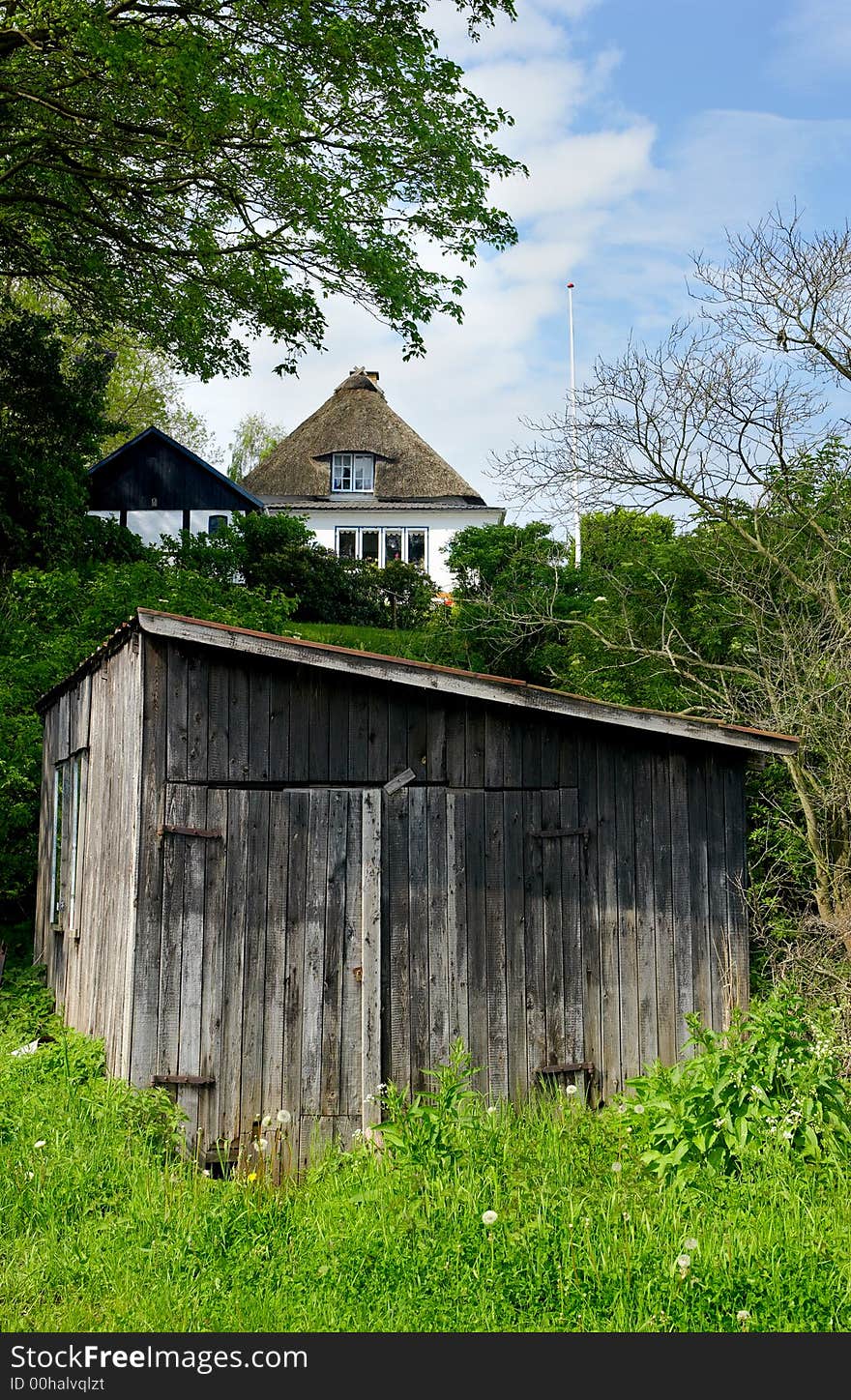 A photo of an old cabin an early summer day (Denmark). A photo of an old cabin an early summer day (Denmark)