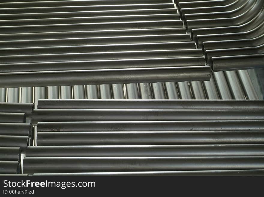 Parallel steel tubes in two layers. Industrial components. Parallel steel tubes in two layers. Industrial components.