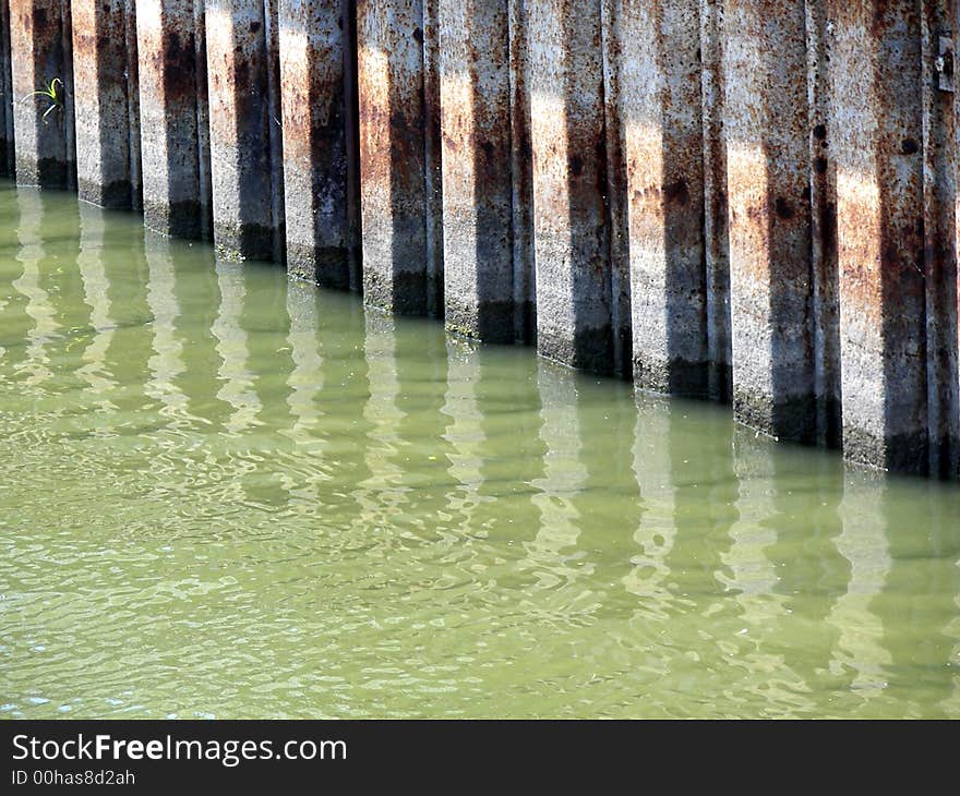 Water level markings on a seawall at a marina