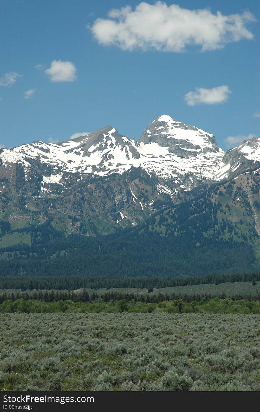 A vertical angle photograph of snow capped mountains in Wyoming. A vertical angle photograph of snow capped mountains in Wyoming.