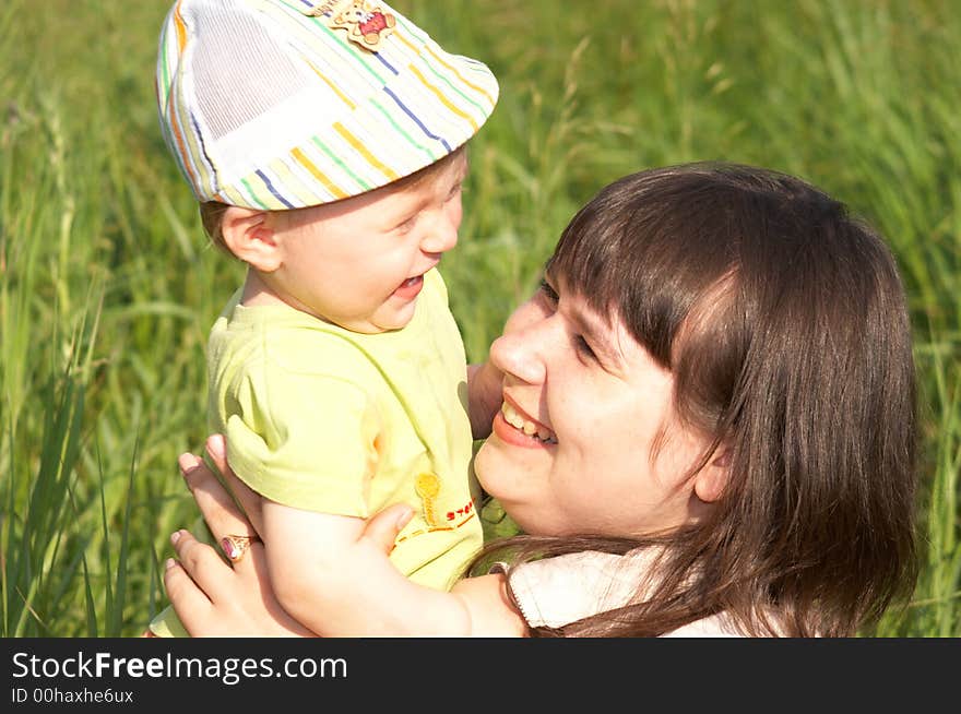 The happy mother with the son on a background of a nature. The happy mother with the son on a background of a nature