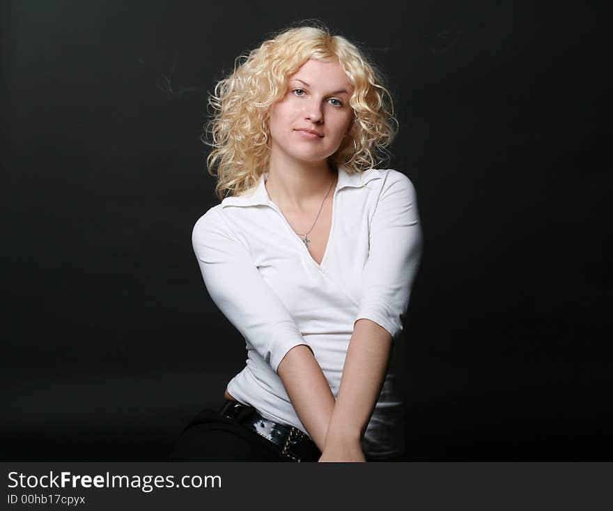 Blonde girl on black background