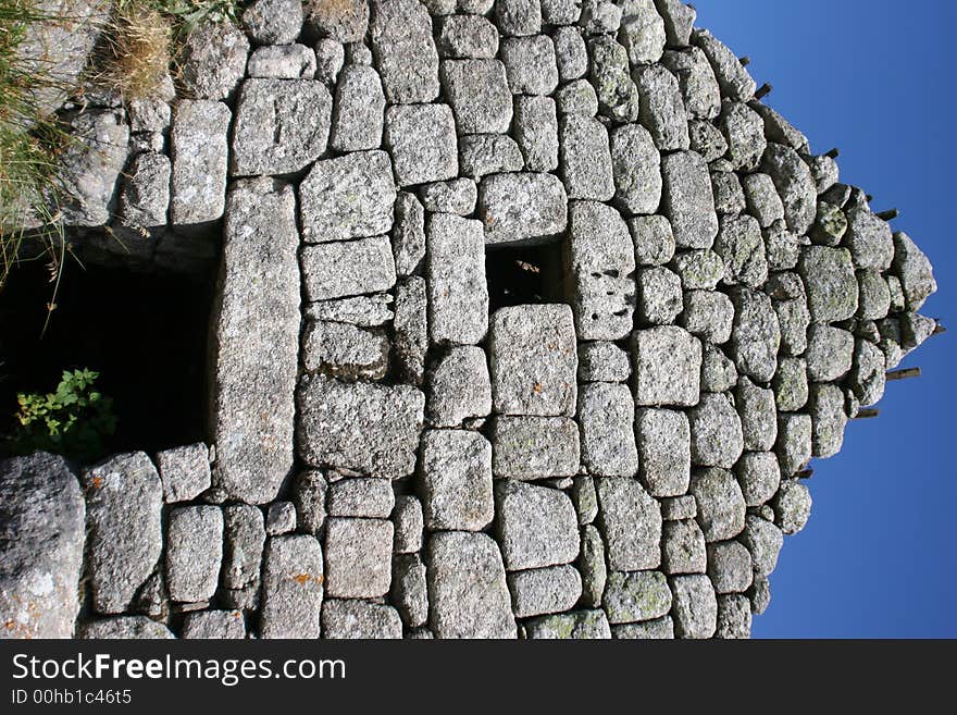 A rocky house lost in a hamlet in france