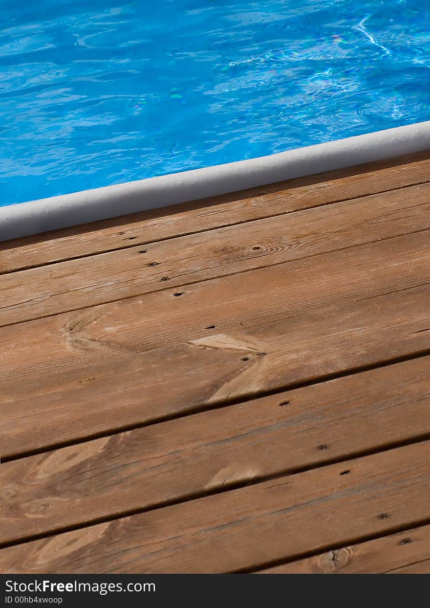 Brown floorboard and azure water. Brown floorboard and azure water