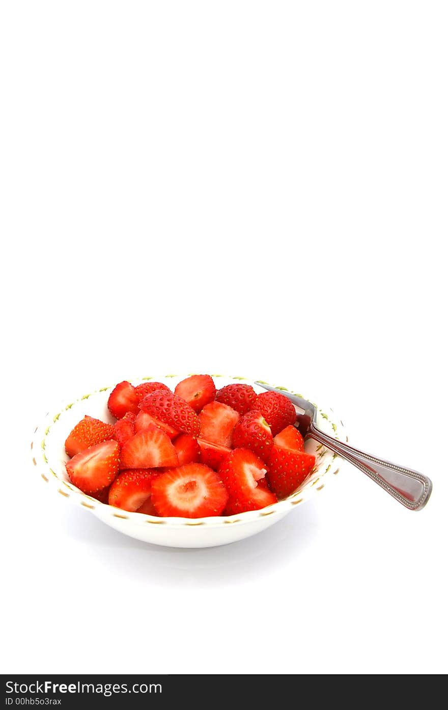 Freshly cut strawberries in a bowl. Freshly cut strawberries in a bowl