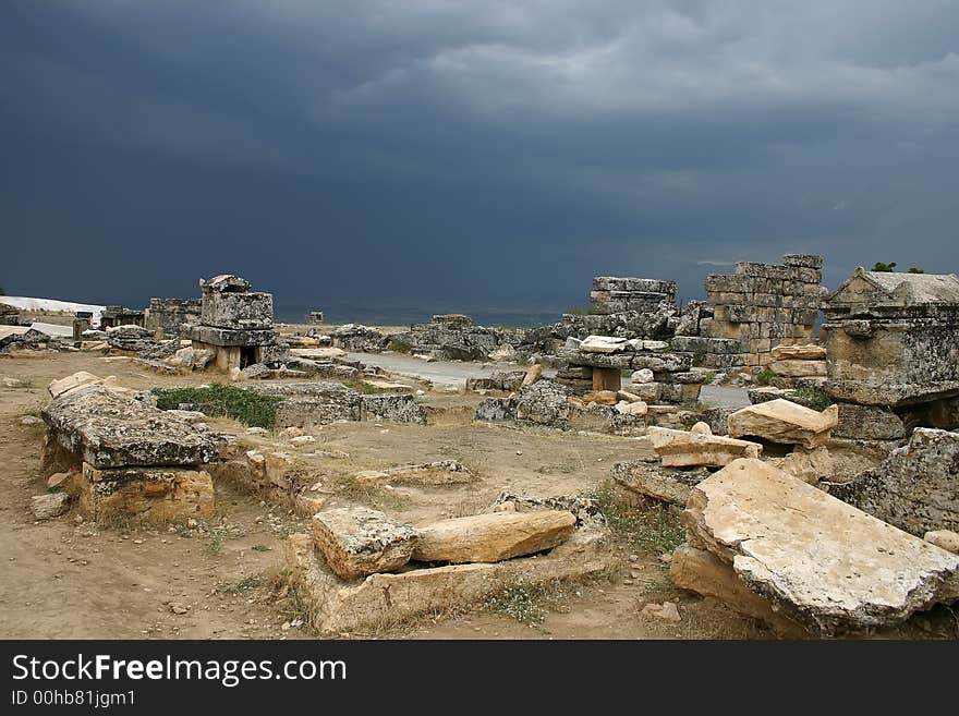 An ancient Roman necropolis, Turkey, peak of Pamukkale mountain. Shortly before thunderstorm. An ancient Roman necropolis, Turkey, peak of Pamukkale mountain. Shortly before thunderstorm