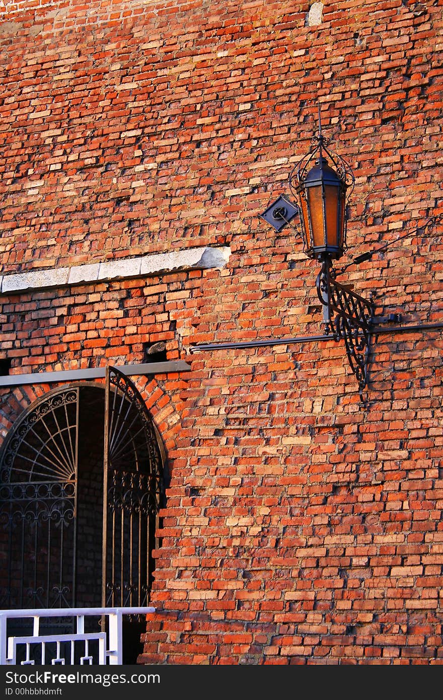 Lantern and gates in old battlement of brick