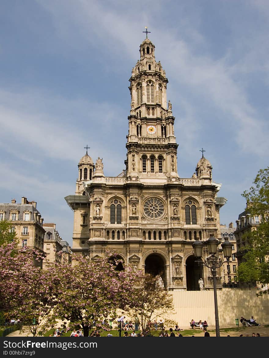 Church in Paris, France, with trees in front and a blue sky background. Church in Paris, France, with trees in front and a blue sky background