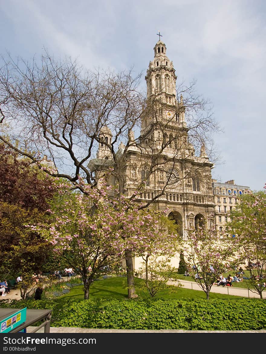 Church in Paris, France, with trees in front and a blue sky background. Church in Paris, France, with trees in front and a blue sky background