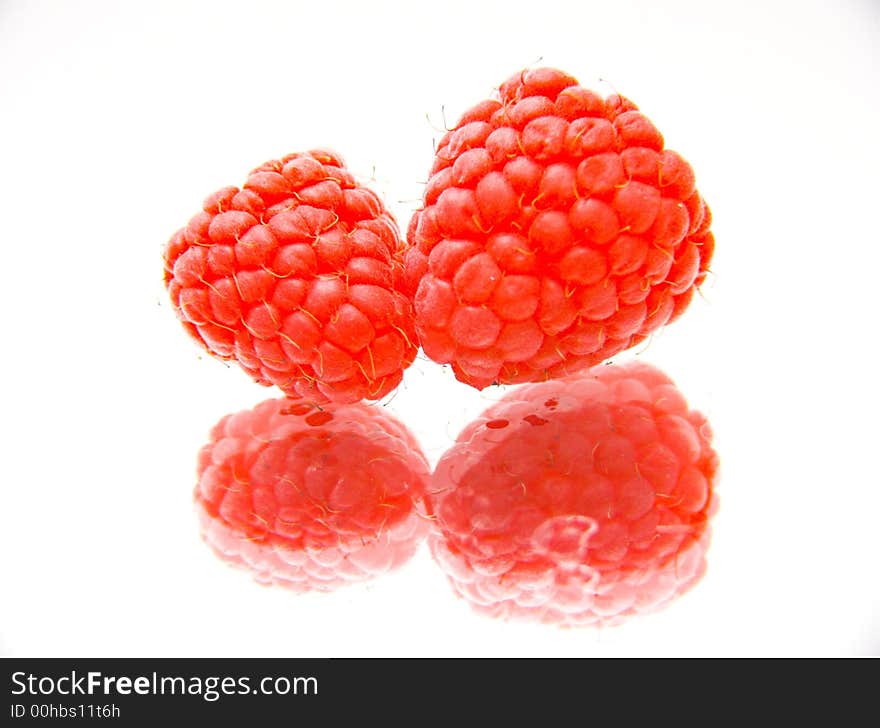 Twor raspberries isolated over white background. Twor raspberries isolated over white background