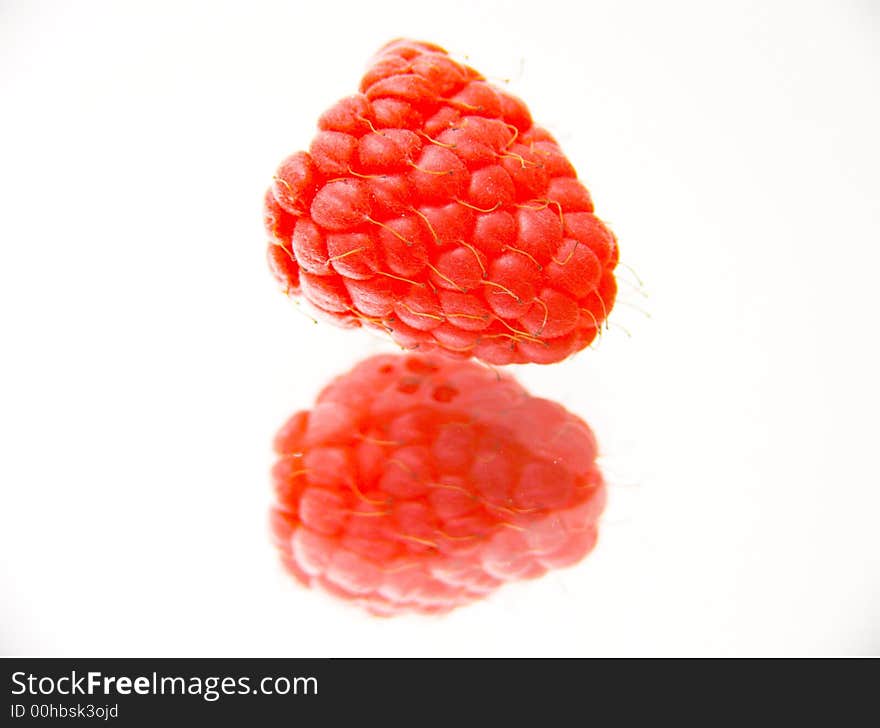 Fresh raspberry isolated over white background