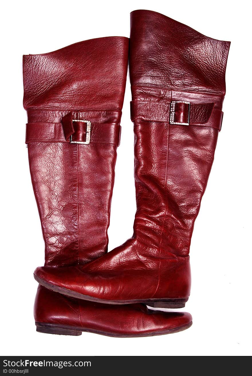 Red leather woman jackboot. Isolated white. Red leather woman jackboot. Isolated white.