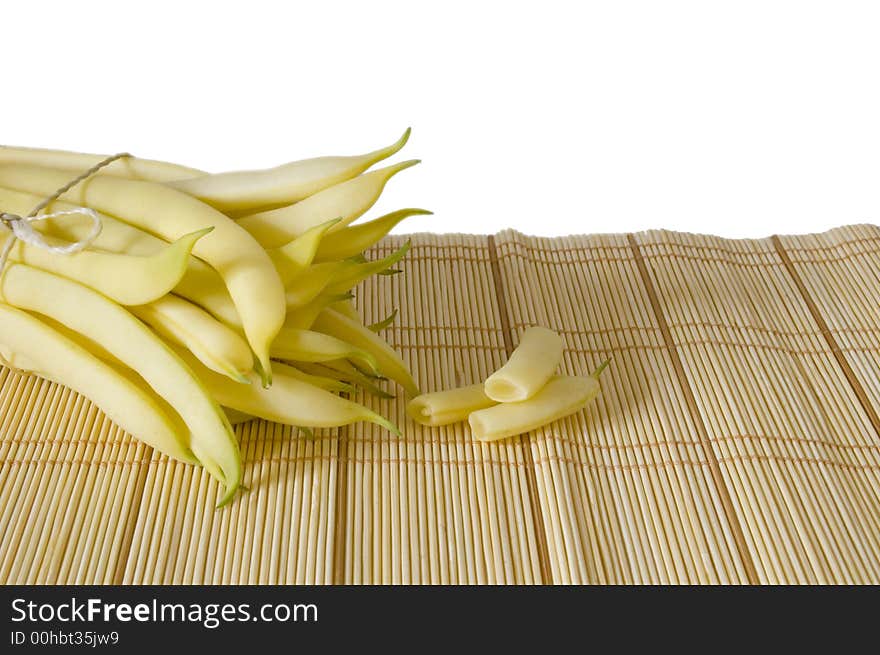 String yellow haricot pods on white isolated