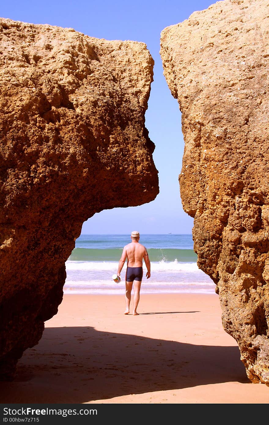 Man Walking To The Ocean